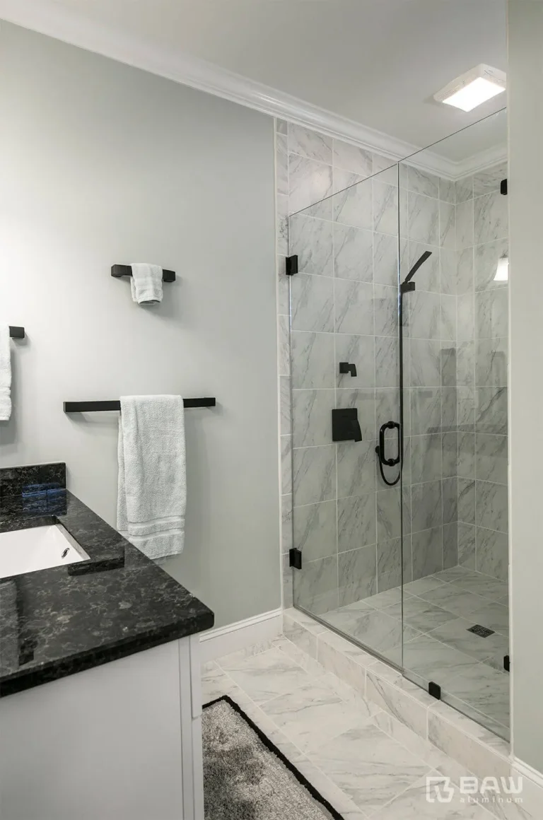 Bathroom with black finishes and glass shower doors