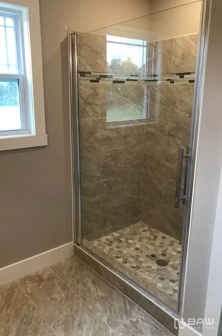 Bathroom with renovated shower area and glass door