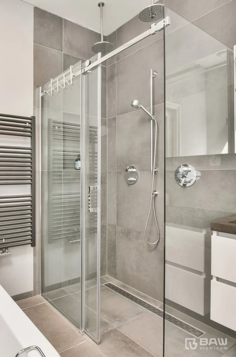 Bathroom with shower door with chrome finishes